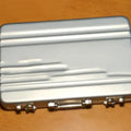 Aluminium alloy metal card holder in red, blue, black, silver, pink, or gold.