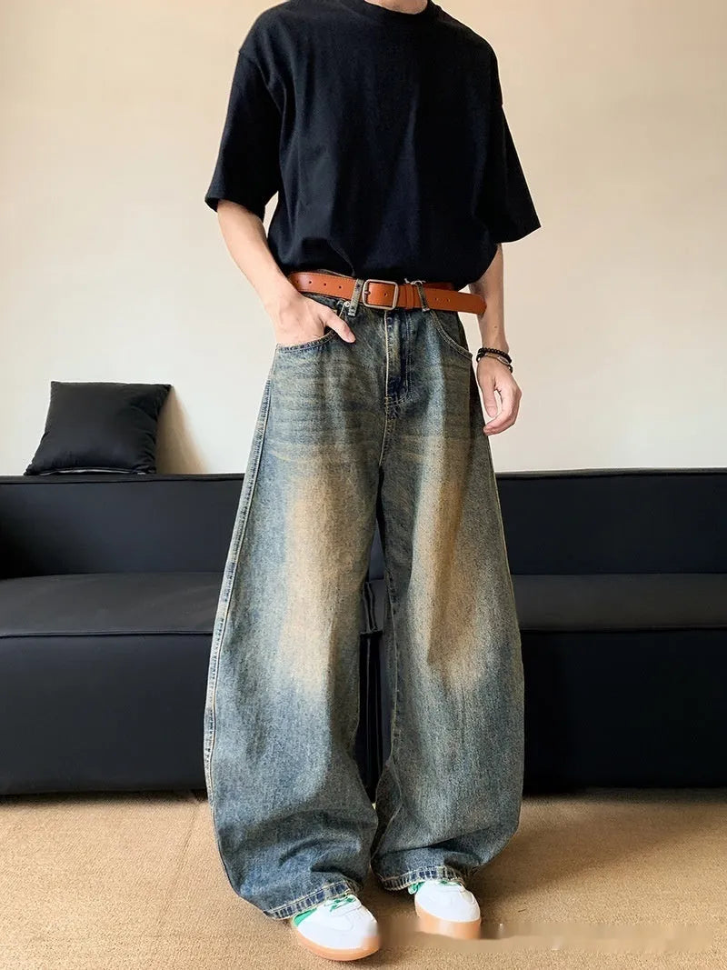 Men's retro blue wide-leg jeans with distressed detailing and machete wash effect