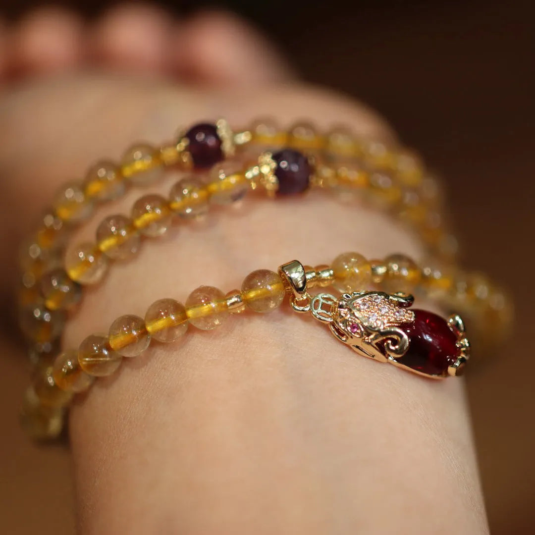 Natural Brazil gold rutilated quartz bracelet with Chinese style design featuring hanging chopsticks and three circles pattern