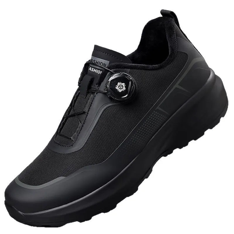 Men's black casual sneakers with a rotating button closure and thick platform sole.