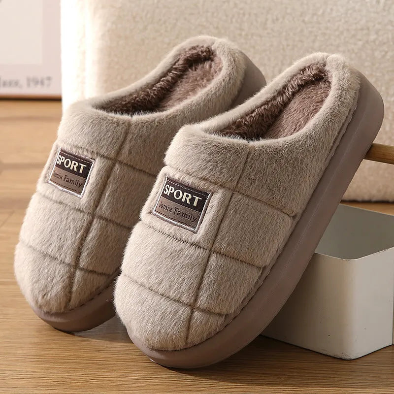 Men's grey thick-soled winter slippers with rabbit hair upper and textured sole.