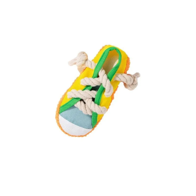 Plastic dog chew toy in yellow, shown bending to produce a sound.