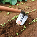 Agricultural pointed hoe with a steel ripper plough tip and a flat hoe profile.