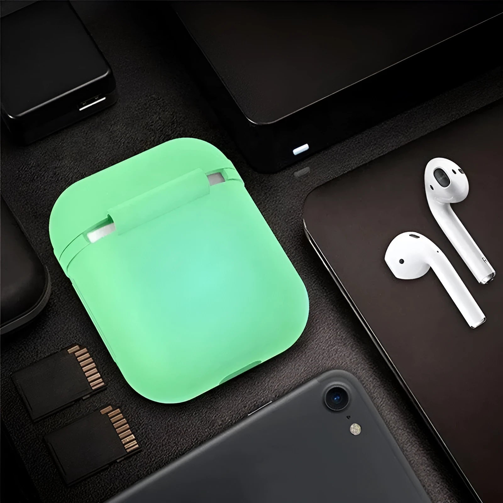 Luminous solid colour silicone flip-top protective case for Apple AirPods earphones.