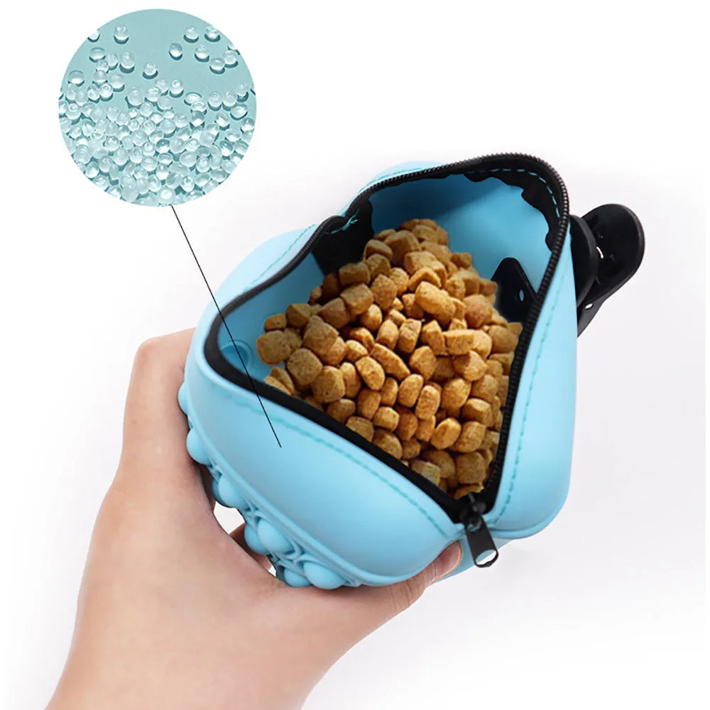 Blue silicone dog training treat pouch with magnetic closure and waist clip on a belt