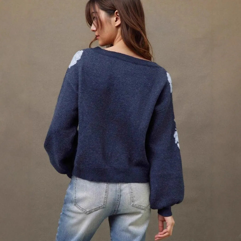 Sapphire blue women's loose pullover with woven floral jacquard pattern on chenille fabric.