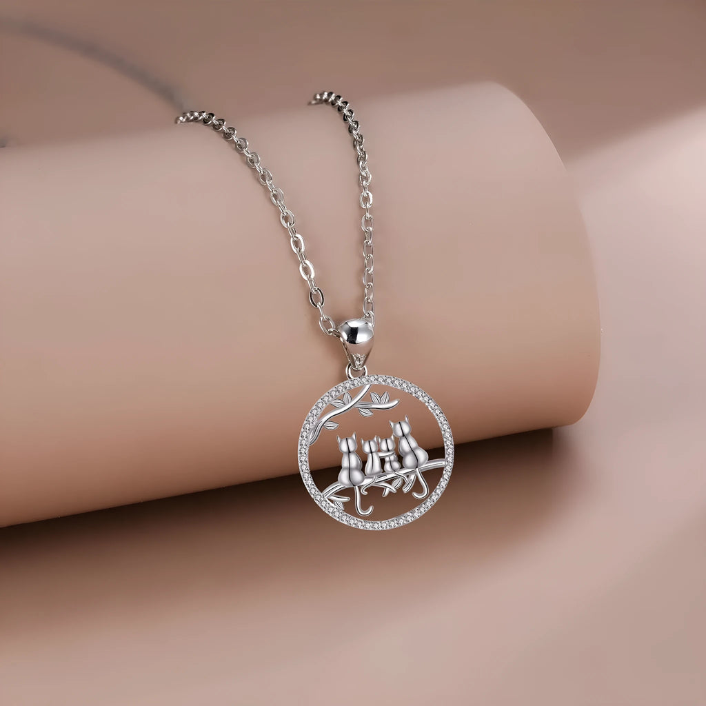 Women's copper necklace with four kitten pendants on cross chain