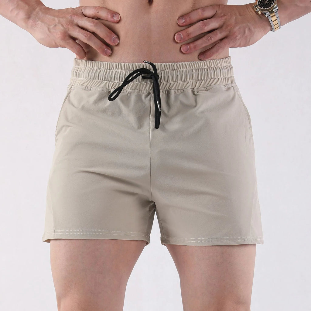 Men's grey thin polyester basketball shorts with an elastic waistband on a white background