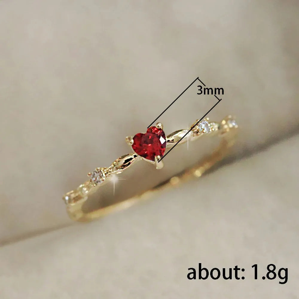 Personalised zircon peach heart ring in gold or silver finish on a copper band.