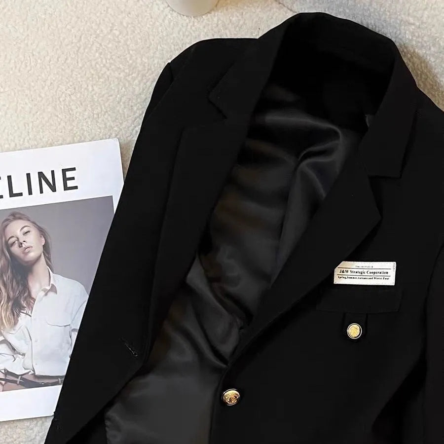 Women's black loose fit polyester suit coat with long sleeves and pocket design