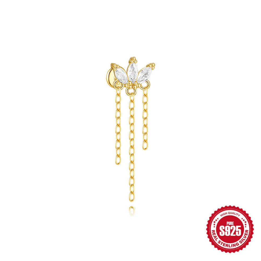 Geometric kite-shaped sterling silver stud earrings with rhinestones and a gold chain tassel.