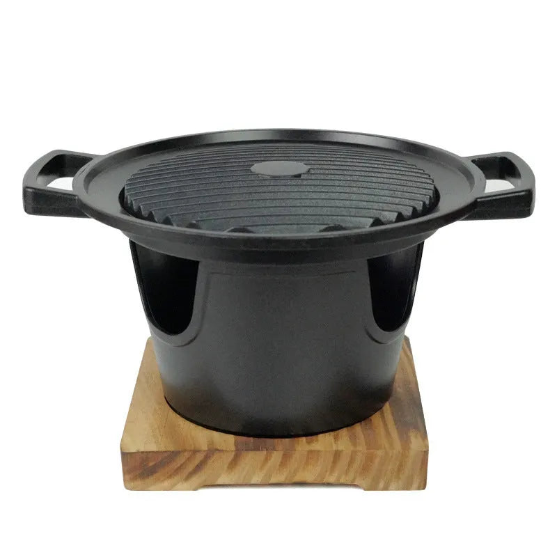 Mini BBQ grill alcohol stove with double-head flame and non-stick plate on tabletop