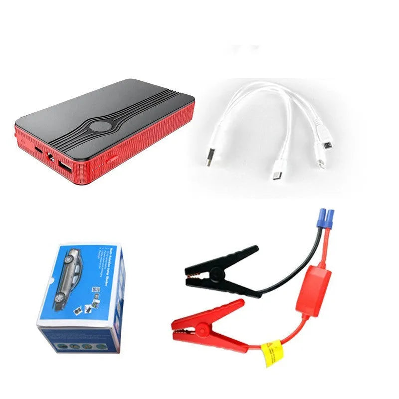Red K4-E car jump starter power bank with display, shown next to a data cable on a dark surface.