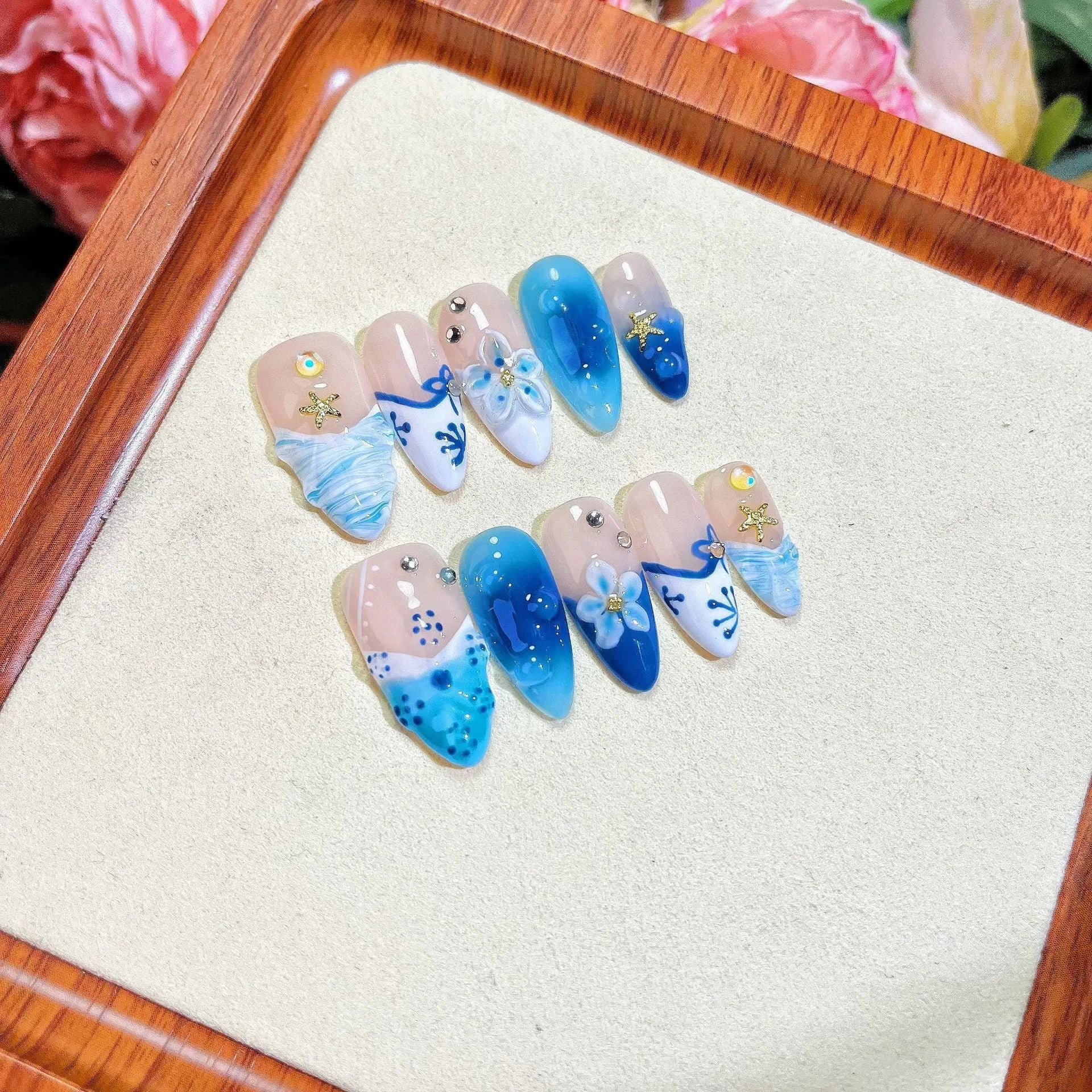 Blue hand-painted carved false nails on transparent summer base with XS, S, M, L size options