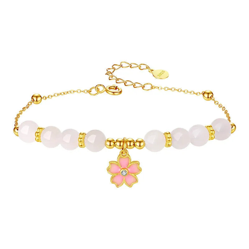 S925 silver bracelet with pink gradient cherry blossom pendant and Hetian jade beads on display