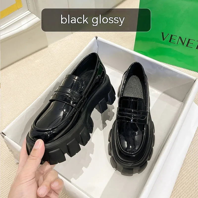 British style wide fit loafers in patent leather with a muffin base heel and rubber sole