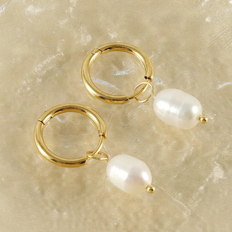 Gold geometric stainless steel earrings with pearl decorative elements and titanium posts