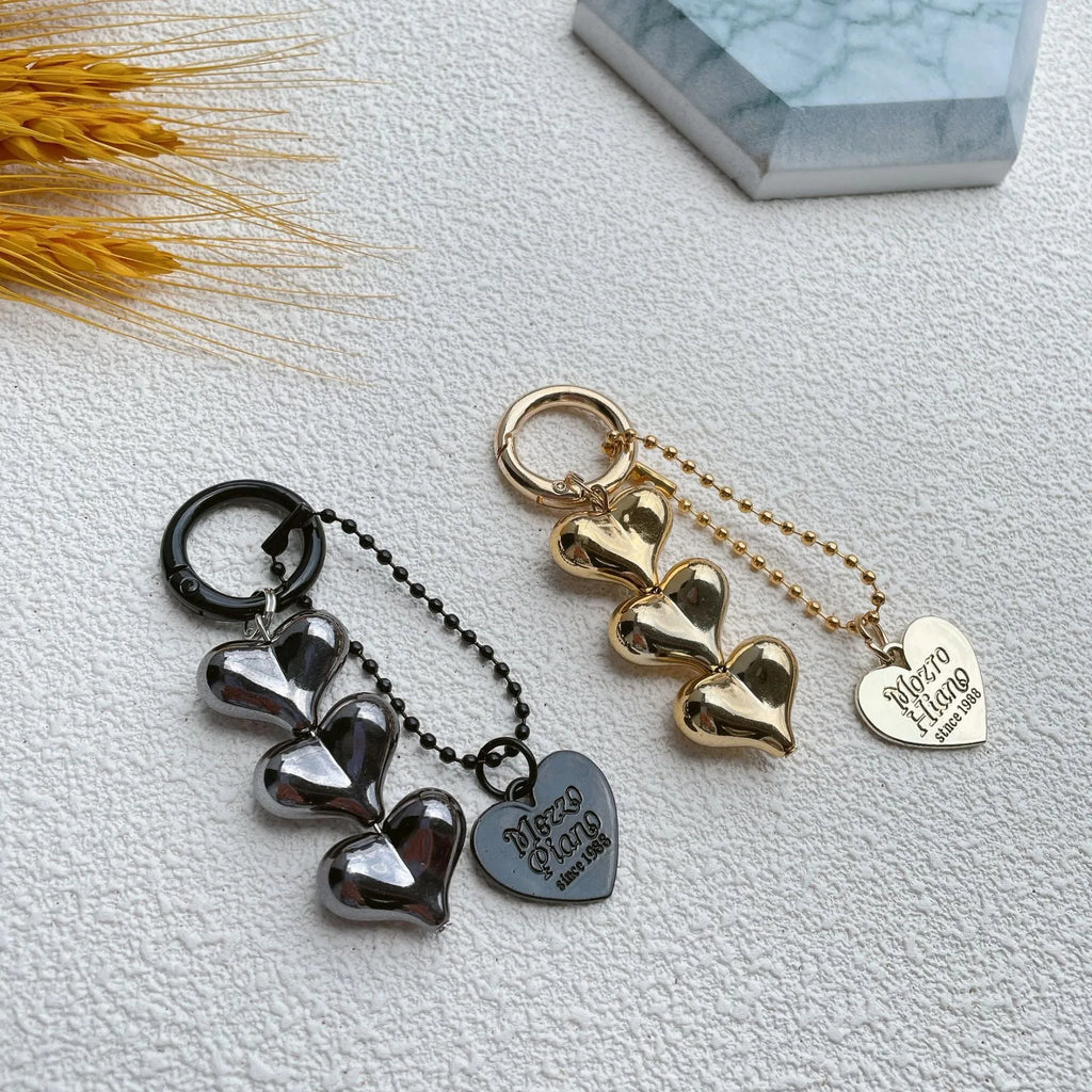 Fart Peach Love electroplated acrylic key ring with heart pattern in black, gold or white