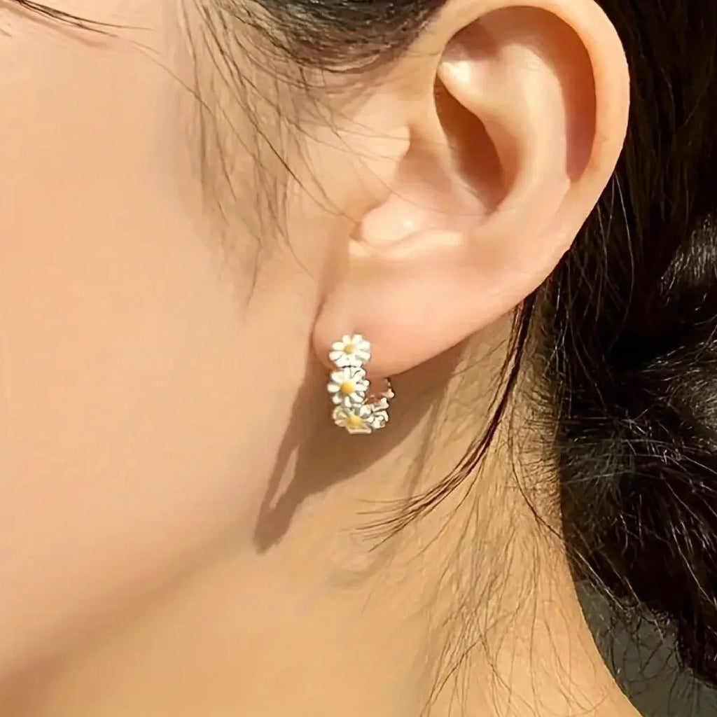 White daisy flower ring earrings with electroplated finish and platinum gem accents on copper