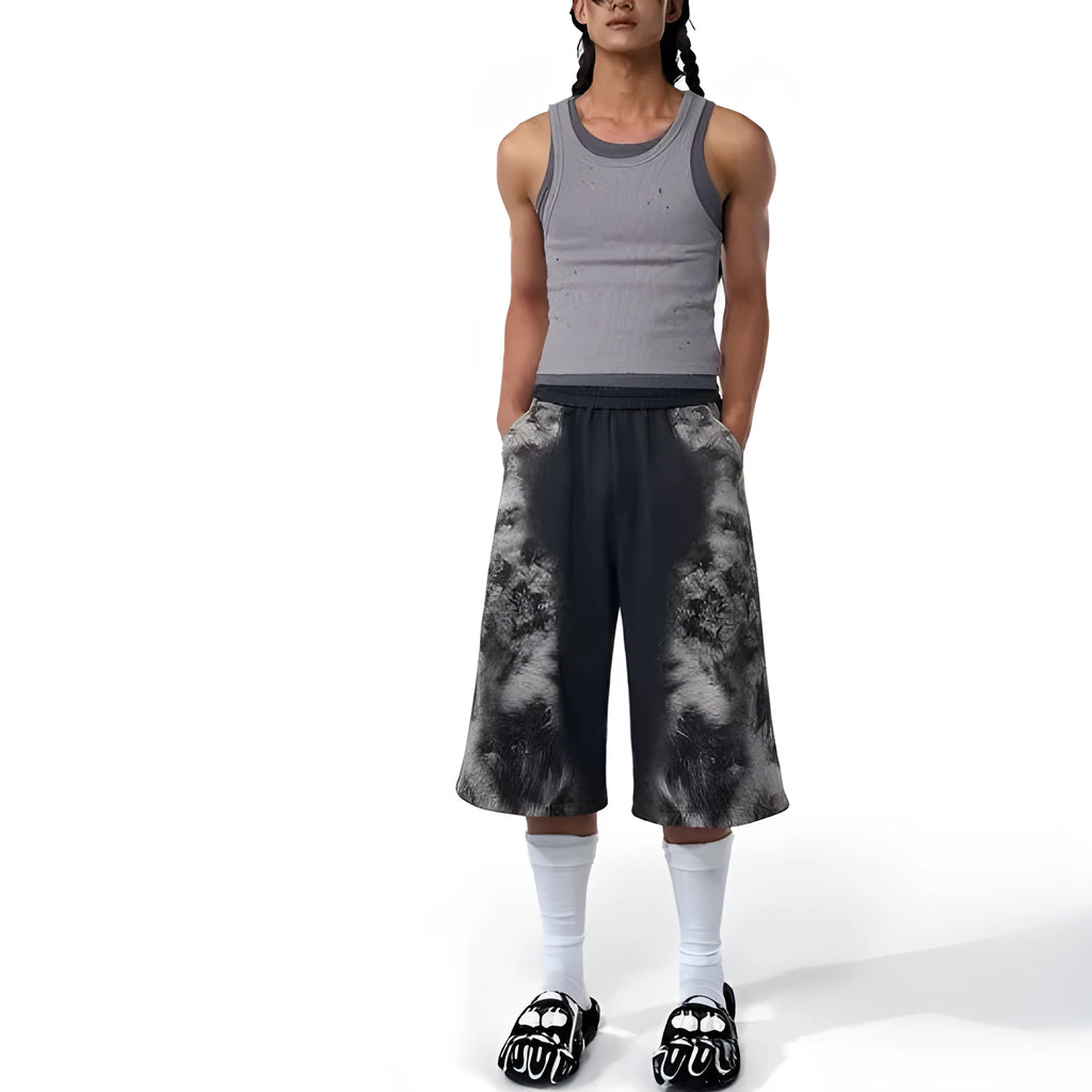 Loose fit streetwear co-ord set showing shorts, trousers, and hoodie with collage stitching detail
