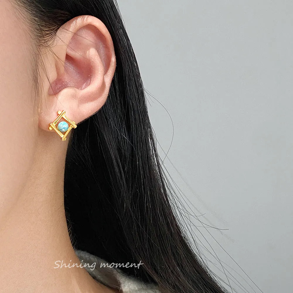 Women's silver geometric cross quadrangle stud earrings with a choice of gold or silver plating.