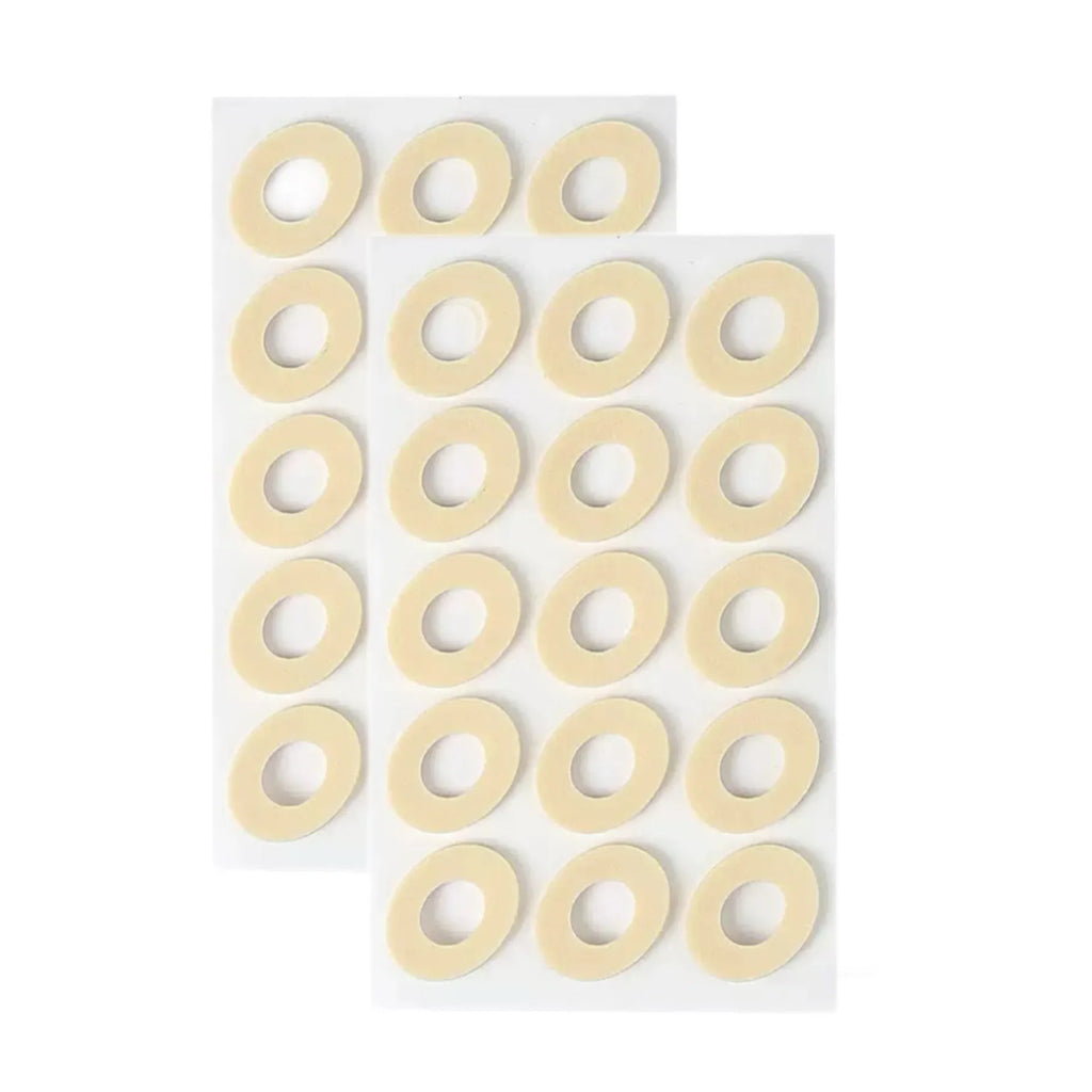 Women's PU heel corn protectors showing four different shapes: circular, large oval, small oval, and U-shaped pads