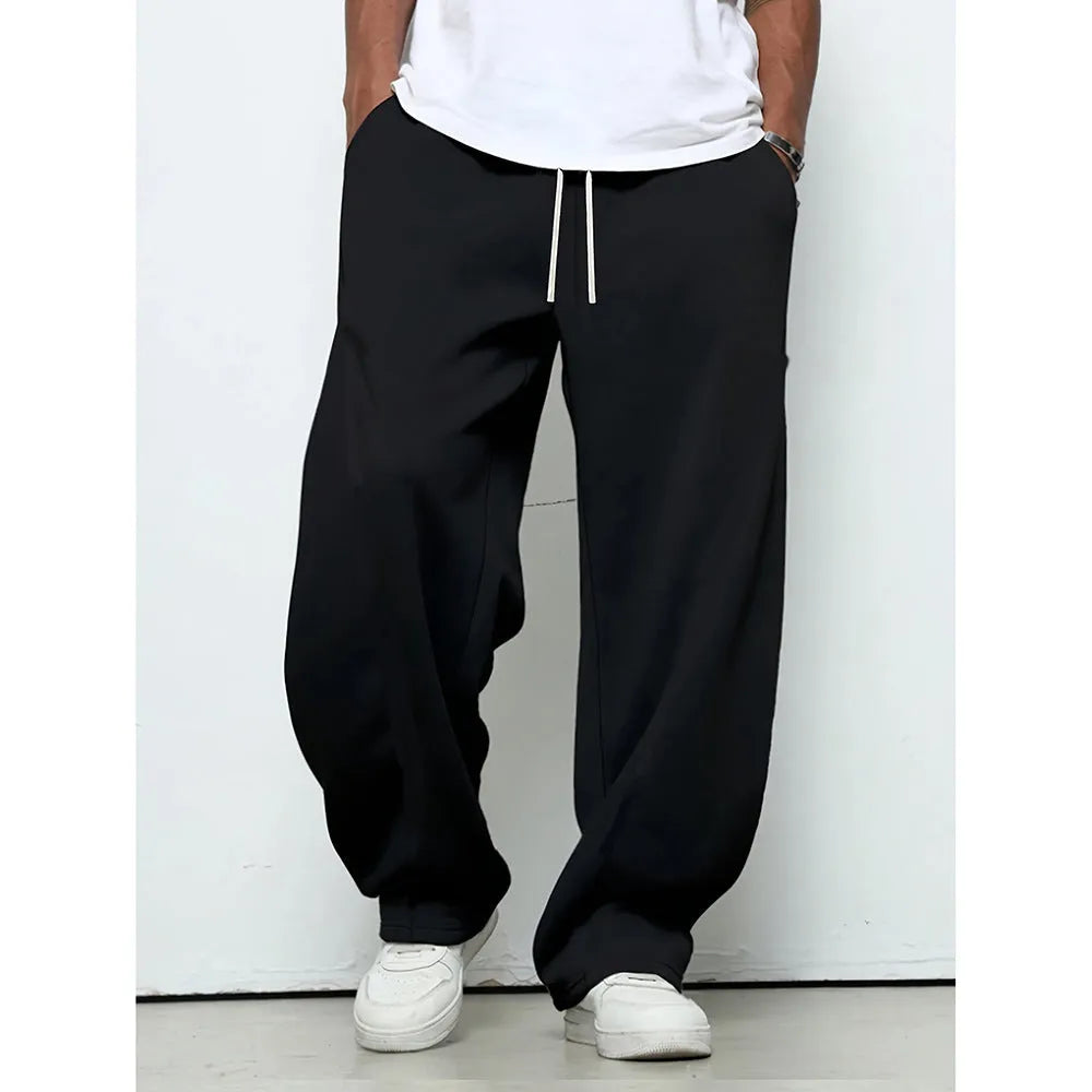 Men's straight leg casual trousers in black, dark grey and light grey colours with a drawstring waist.
