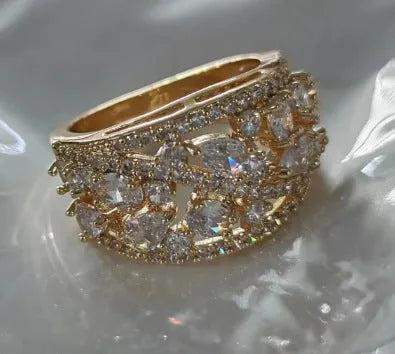 Women's hollow round copper fashion ring showing gold and platinum finishes with sapphire blue and white diamond accent options
