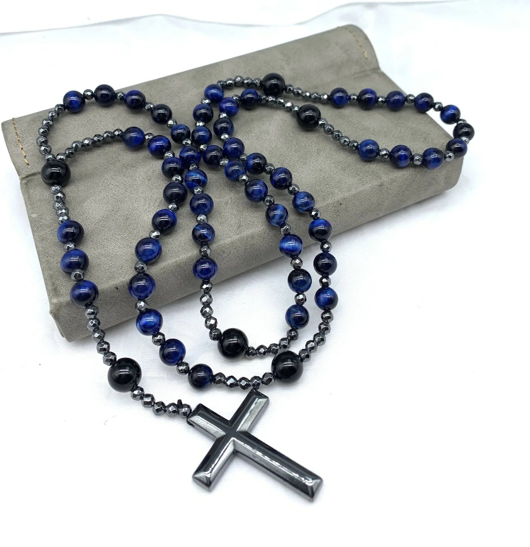 Men's stone cross pendant necklace with hand-woven detail on ball bead chain