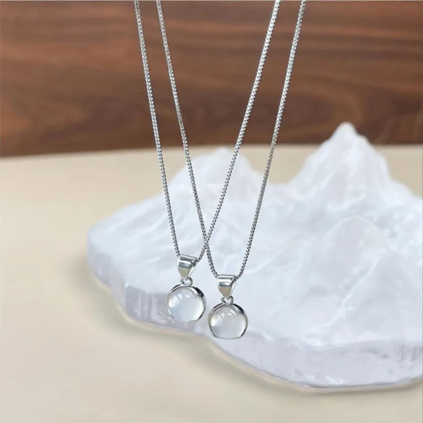 Korean-style oval pendant necklace with an eight-point star on an adjustable silver-toned box chain.