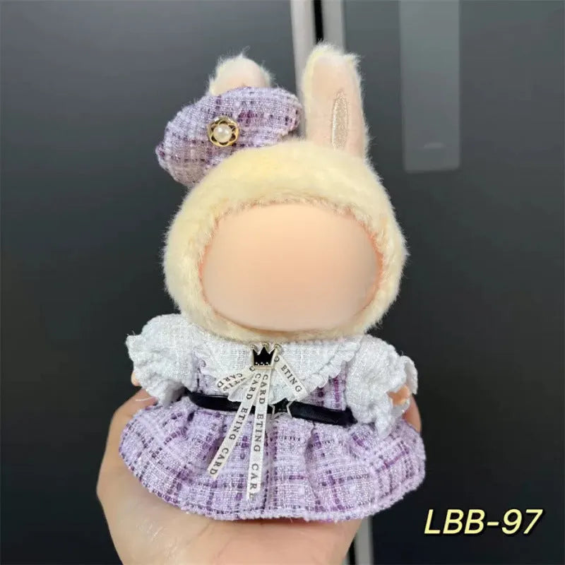 Plastic doll costume outfit designed for 17cm tall vinyl figurines on a display stand.
