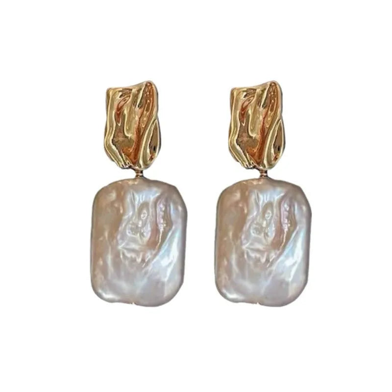 Square stud earrings with natural freshwater pearl in geometric quadrilateral setting