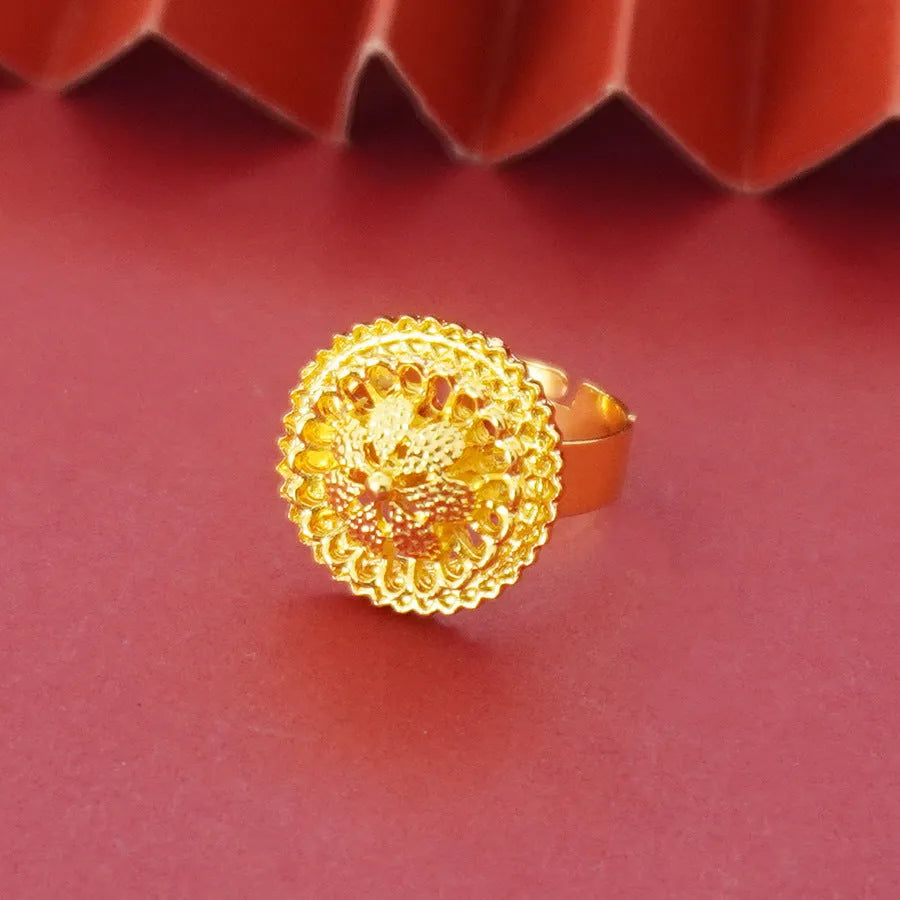 Gold-coloured three-piece jewellery set showing necklace with water wave chain, floral design earrings, and matching ring.