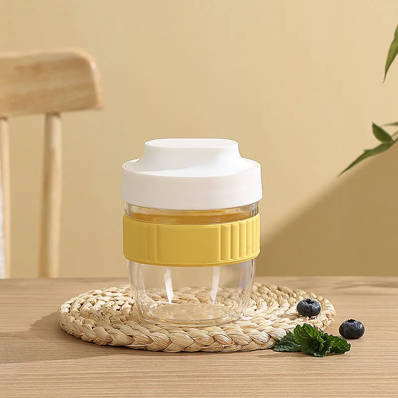 Green microwave-safe plastic salad cup with white resealable lid and integrated spoon, shown with capacity options.