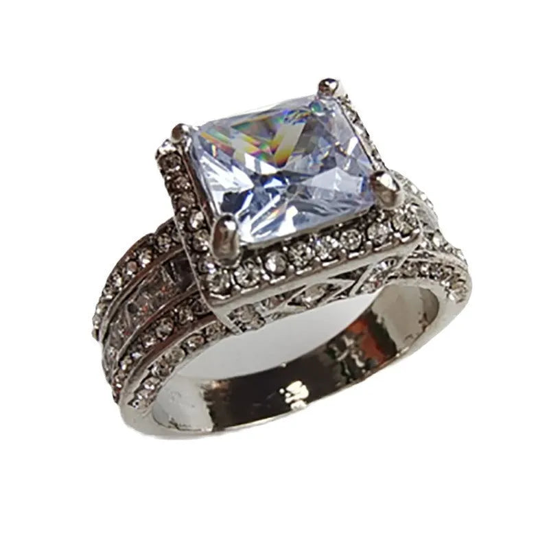 Women's silver geometric engagement ring with electroplated gold or white finish and round design