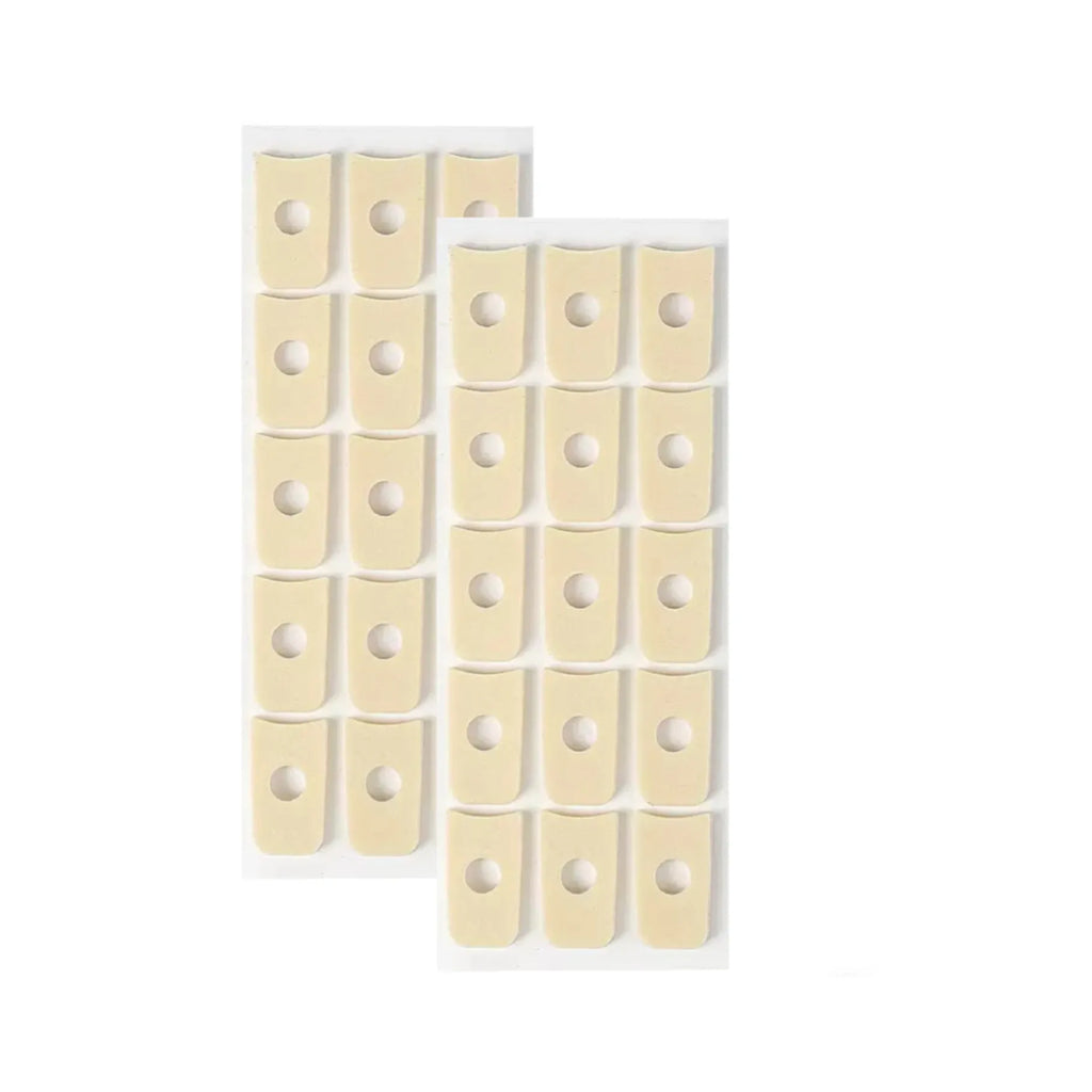 Women's PU heel corn protectors showing four different shapes: circular, large oval, small oval, and U-shaped pads