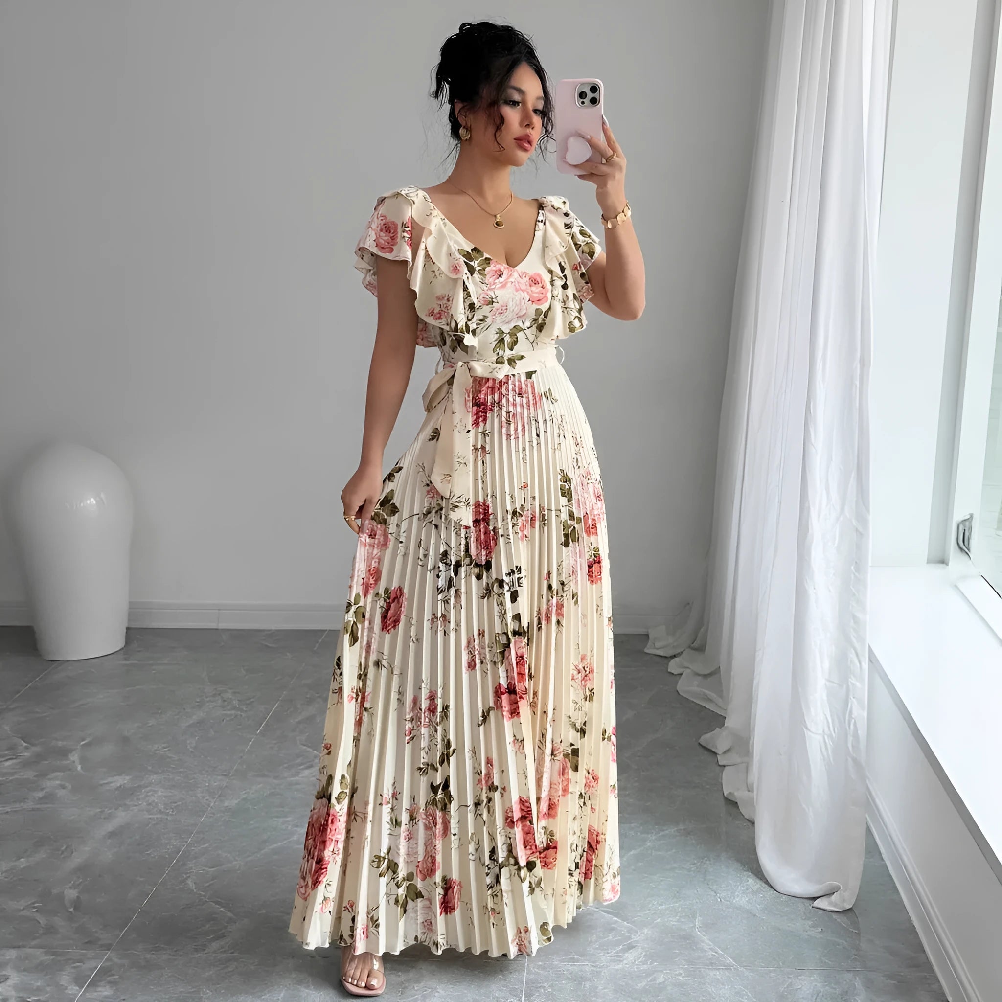 Apricot colour dress with digital floral print, V-neck, ruffled short sleeves, and a high-waisted oversized swing skirt.