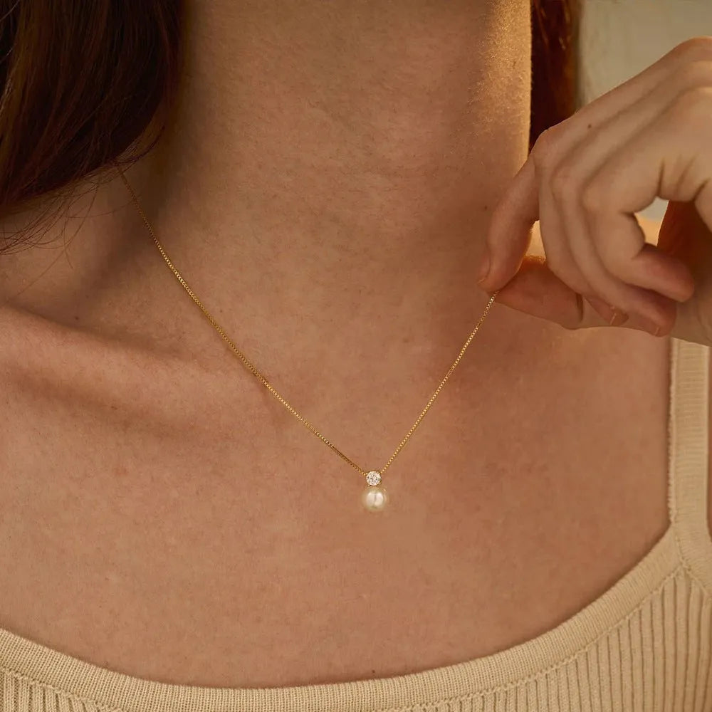 St Delan stainless steel necklace for women with imitation pearl and zircon pendant on a box chain.