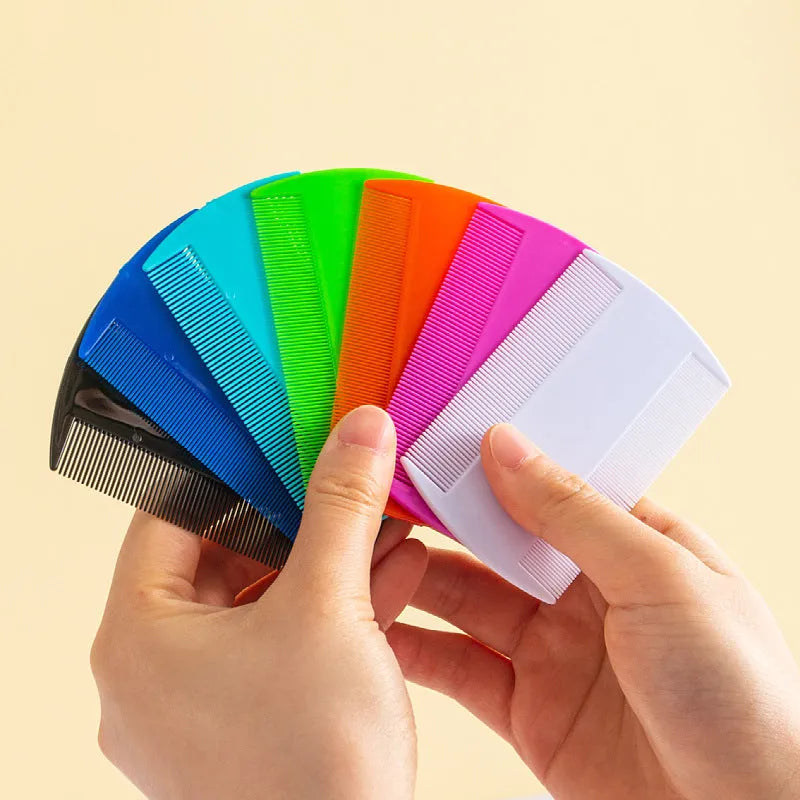 Double-edged plastic fine tooth flea and lice comb in assorted colours on a white background.