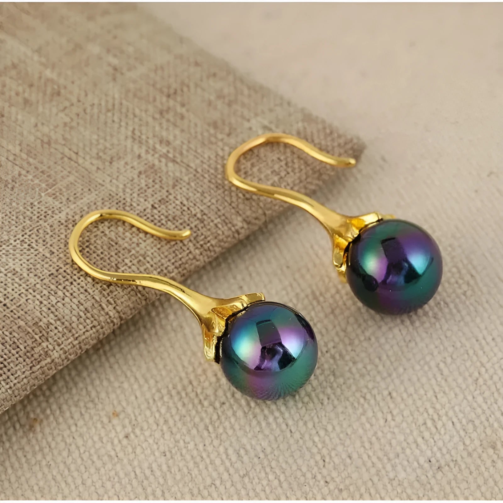 A pair of retro-style women's earrings with an electroplated imitation gold finish