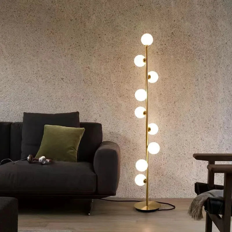 Minimalist modern floor lamp with wrought iron and glass construction, marble base, and adjustable light colours.