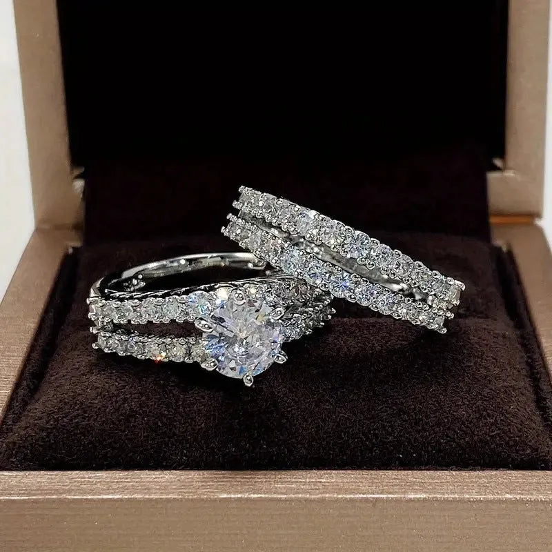 Geometric fully-jewelled female ring set in silver, gold, and rose gold colour options on a size chart.