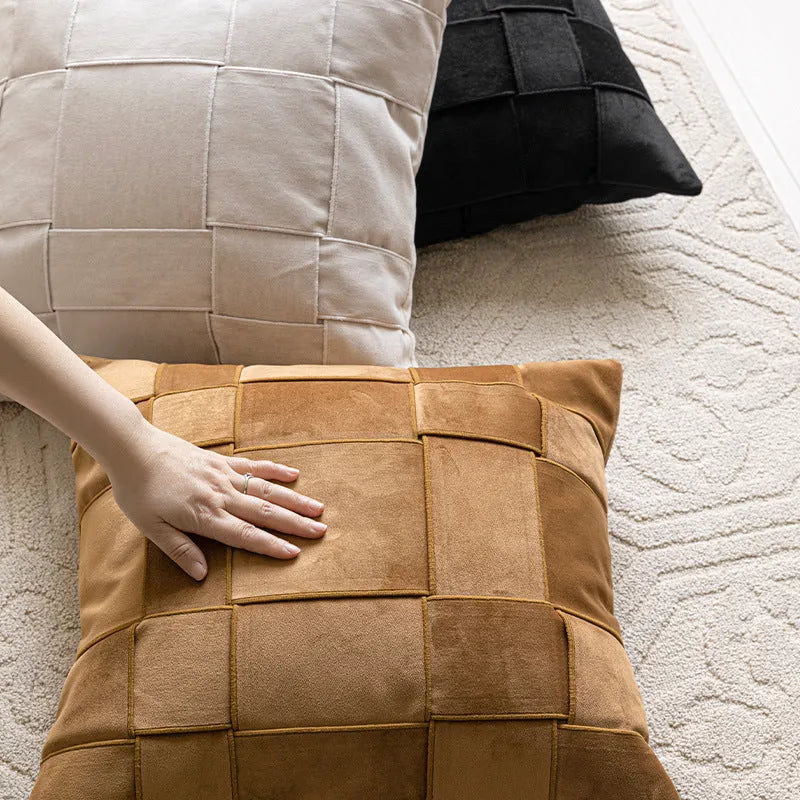 Square woven chenille pillow cushion in beige colour on a grey sofa, 50cm by 50cm size.