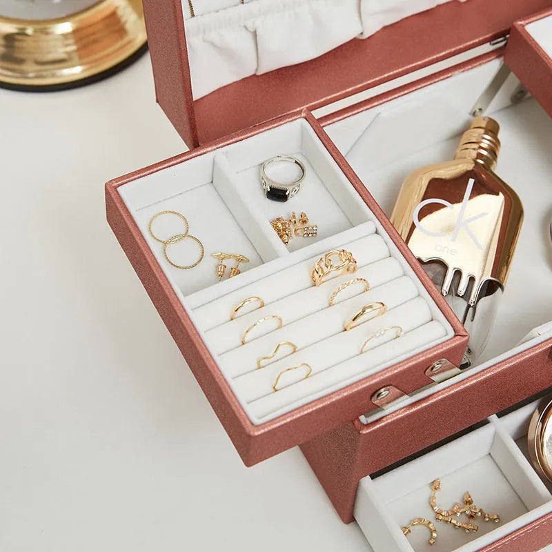 Hard leather jewellery storage box in beige, black, pink, or rose gold colour.