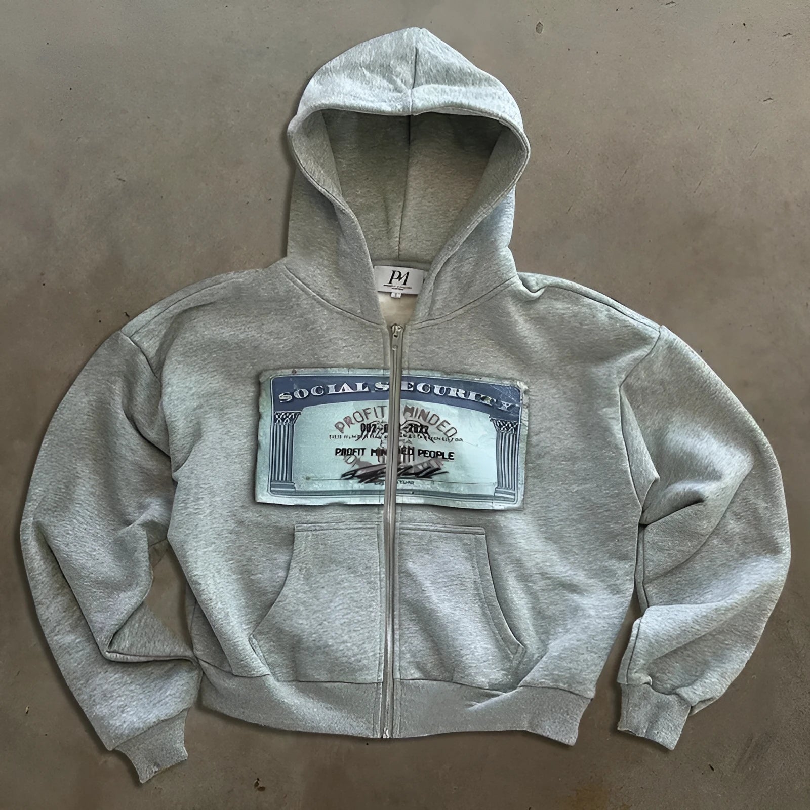 Unisex hooded zip jacket with front pocket in black, grey or pink colours