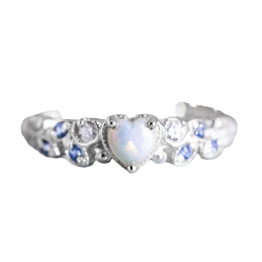 White electroplated alloy women's ring in a heart shape with a flower opal ocean design on its face.