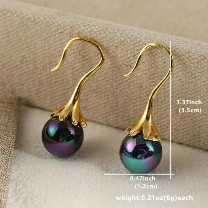 A pair of retro-style women's earrings with an electroplated imitation gold finish