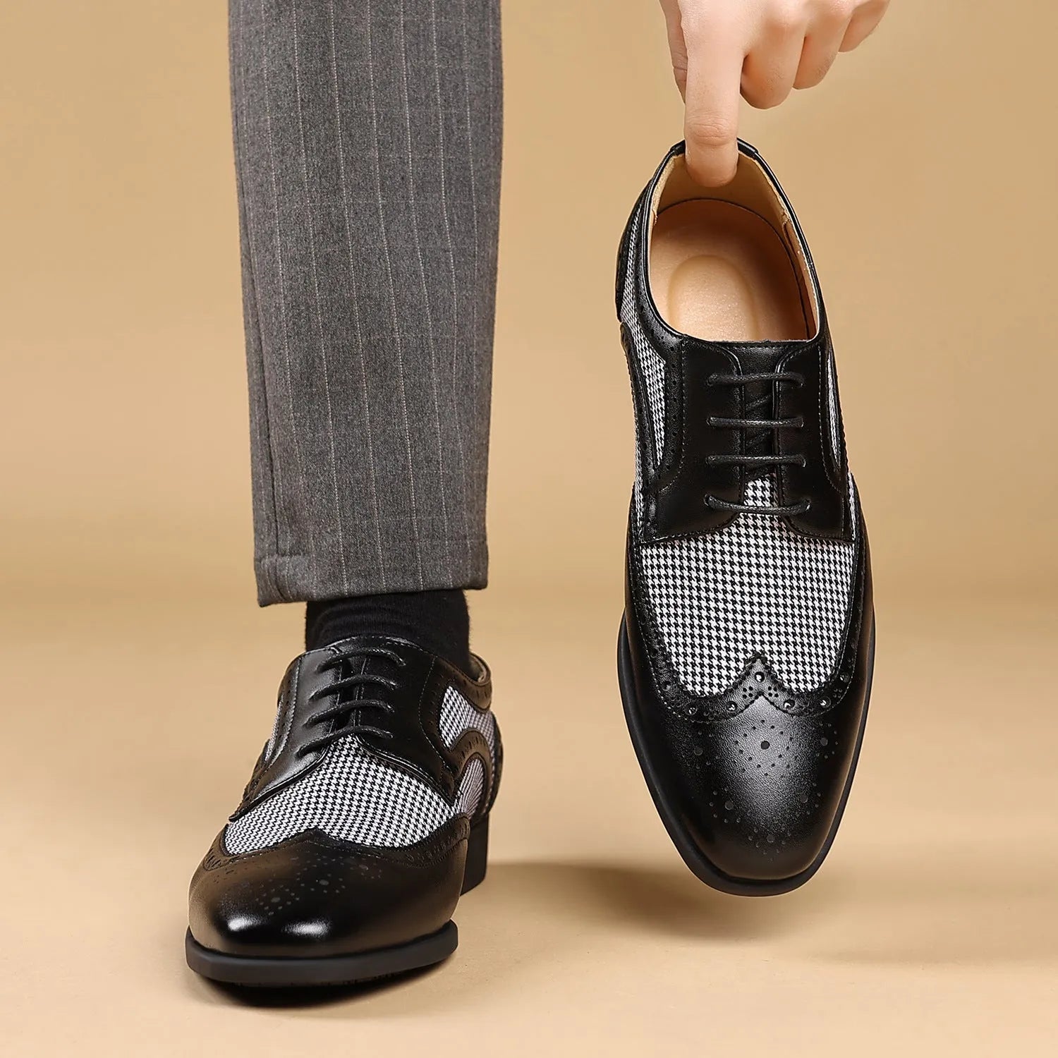 Man's imitation houndstooth plaid casual shoe in black with square toe and lace-up front.