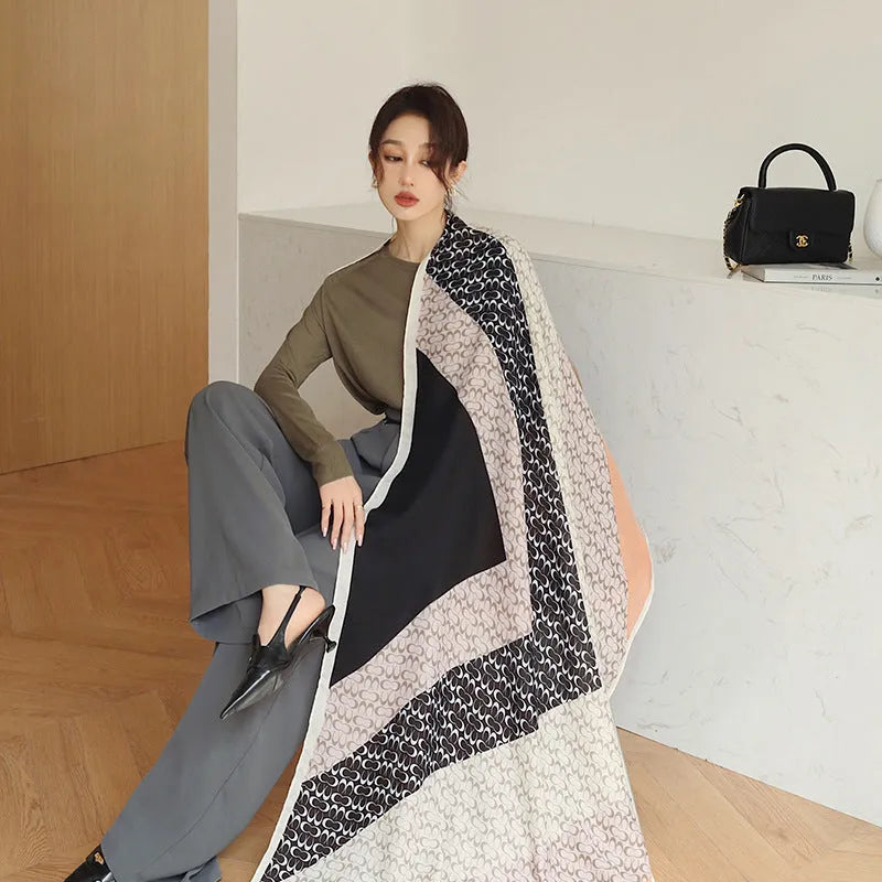Polyester vintage print scarf draped to show 90x180cm dimensions and decorative pattern