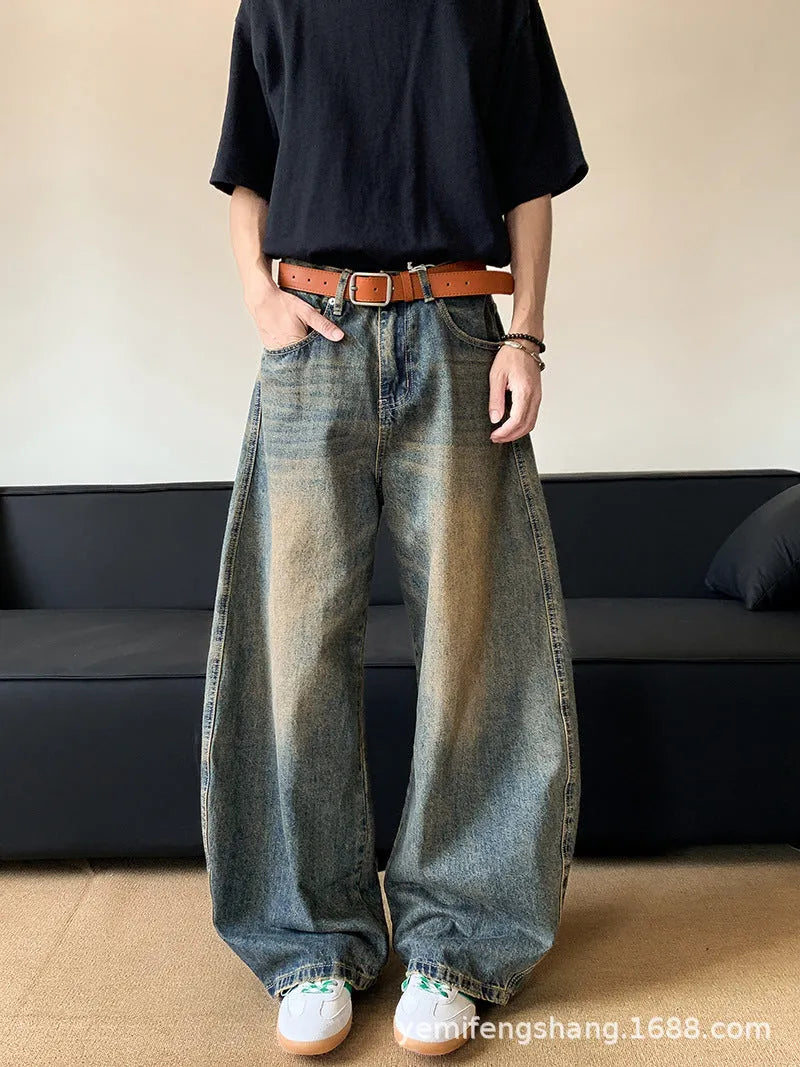 Men's retro blue wide-leg jeans with distressed detailing and machete wash effect